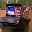 Am urcat cu picioarele pe un laptop, am văzut laptopul rulabil Lenovo şi modelul Yoga 9 cu două ecrane