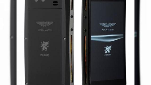 <b>Încă un telefon de lux Aston Martin de la Mobiado - Grand Touch, cu funcții de Nexus S</b>Mobiado este unul dintre acele branduri de telefoane de lux, pe care le vedem de obicei asociate cu jucătorii de fotbal sau miliardarii. De această dată ei anunță lansarea unui telefon Android cu touchscreen, creat în colaborare cu Aston Martin,...