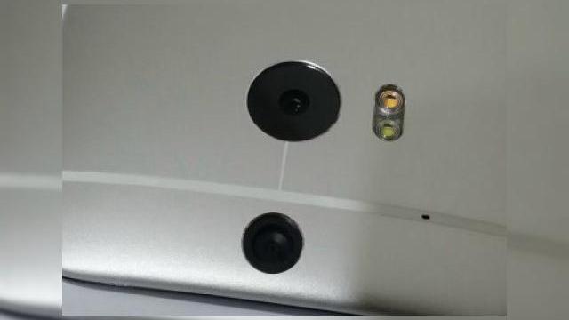 <b>De ce are HTC One 2014 cameră duală În spate? O broșură a unui operator australian da răspunsul!</b>Multă vreme am fost în ceață cu privire la camera de pe noul HTC One, apoi am văzut și primele imagini care confirmau prezența unei camere duale. Acum aflăm prin intermediul unei broșuri a unui operator australian de ce a fost...